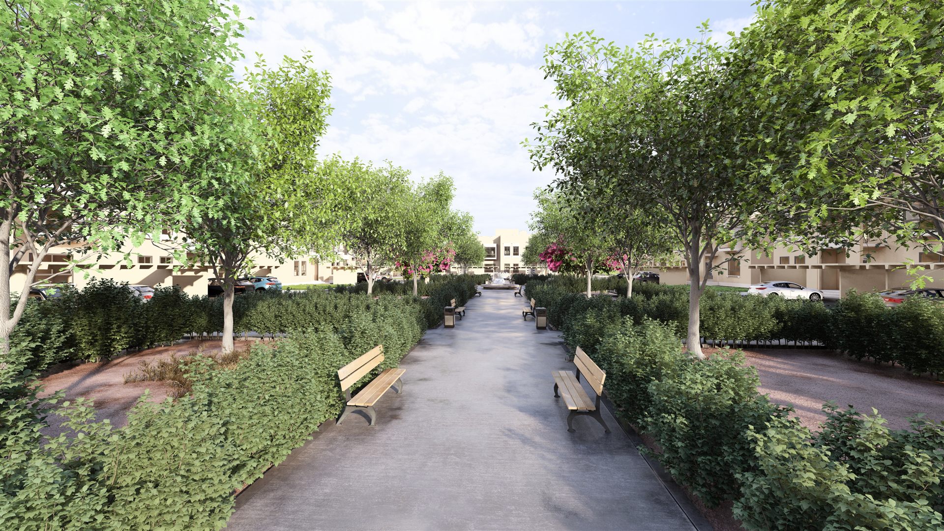 Hedge-lined walkway shaded by trees
