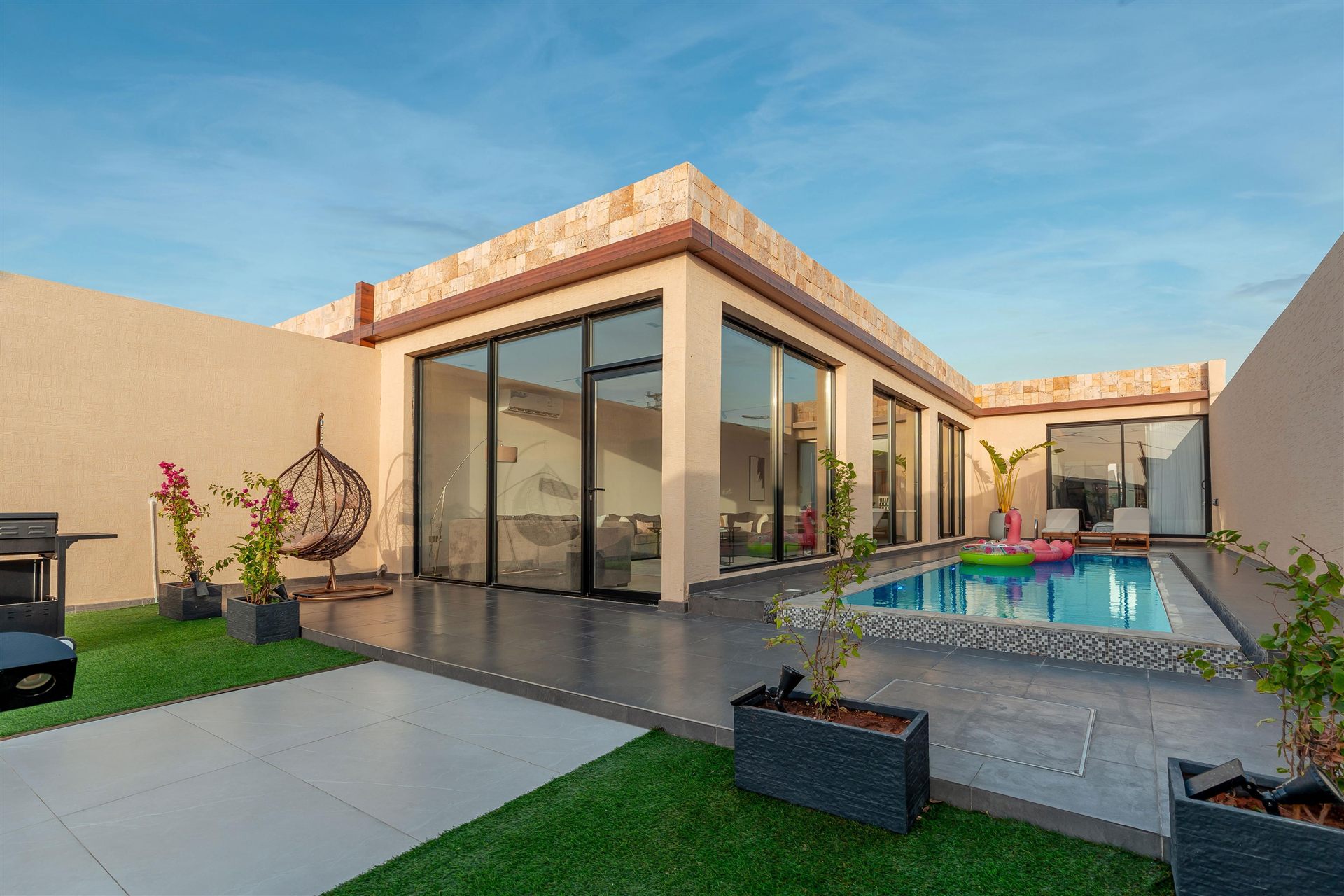 Courtyard and pool at golden hour, built